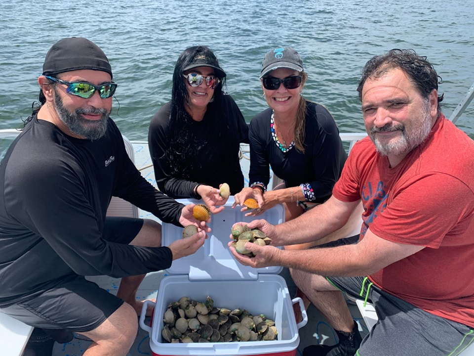 a group of people eating hot dogs