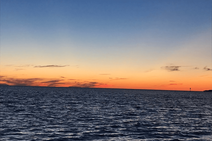 a sunset over a body of water