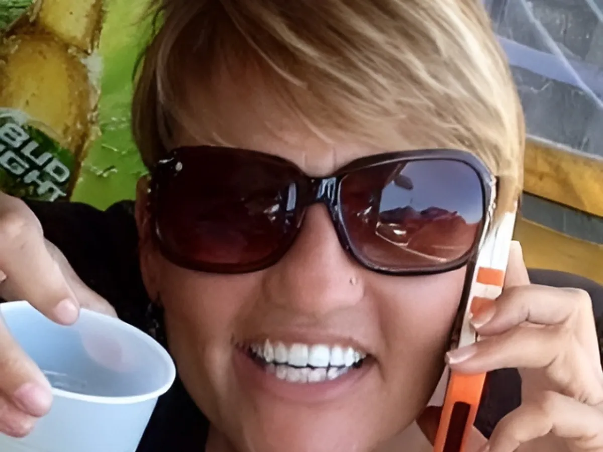 a woman holding a cup